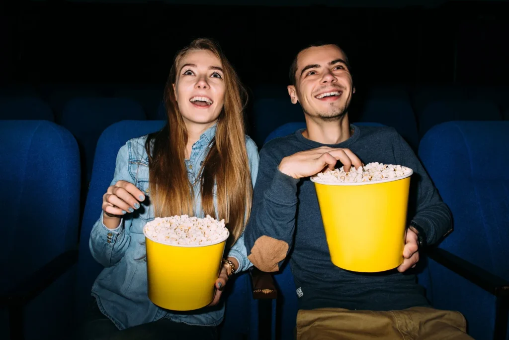 best date entertainment cinema young couple enjoying movie cinema scaled 1